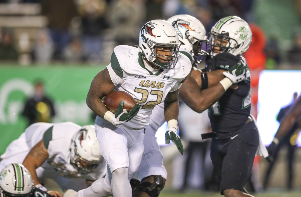 UAB Blazers running back DeWayne McBride (22) runs the ball against the Marshall Thundering Herd during the fourth quarter at Joan C. Edwards Stadium.
